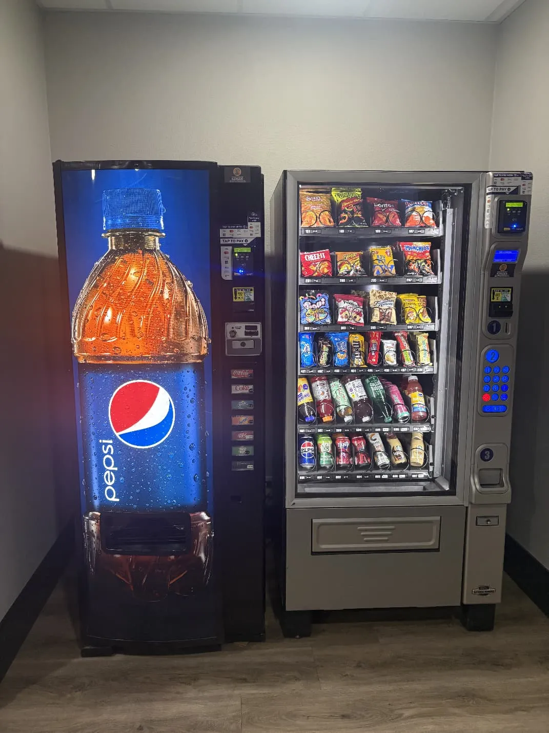 Pepsi drink machine and snack vending machine installed in an office hallway